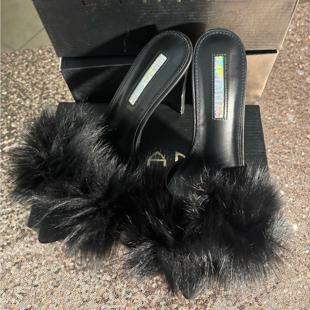 Black fur heels. Worn twice . In very good condition.